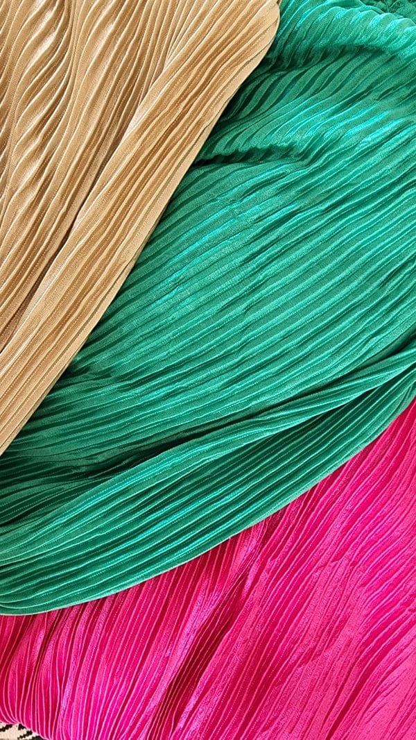 Long fine pleated dress.
