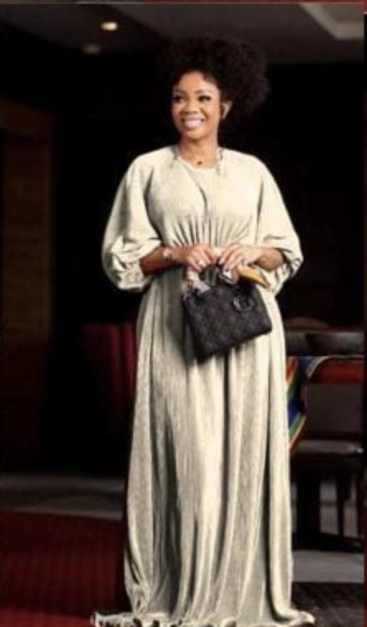 Long fine pleated dress.