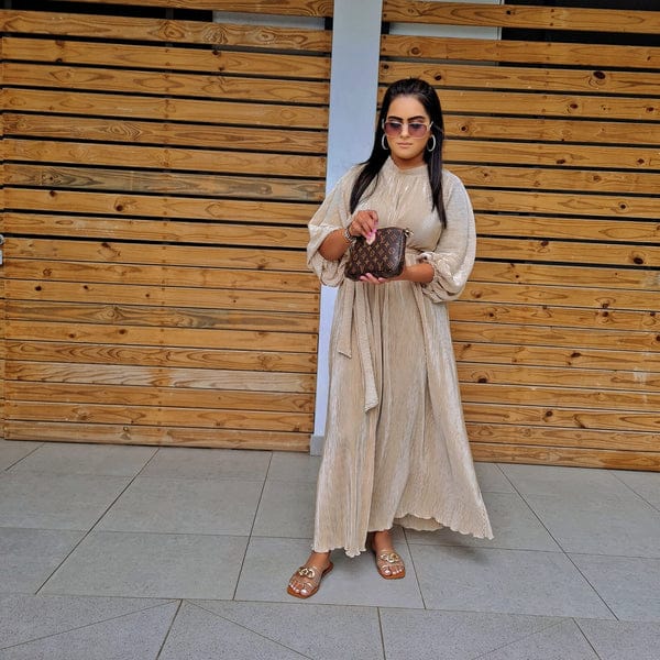 Long fine pleated dress.