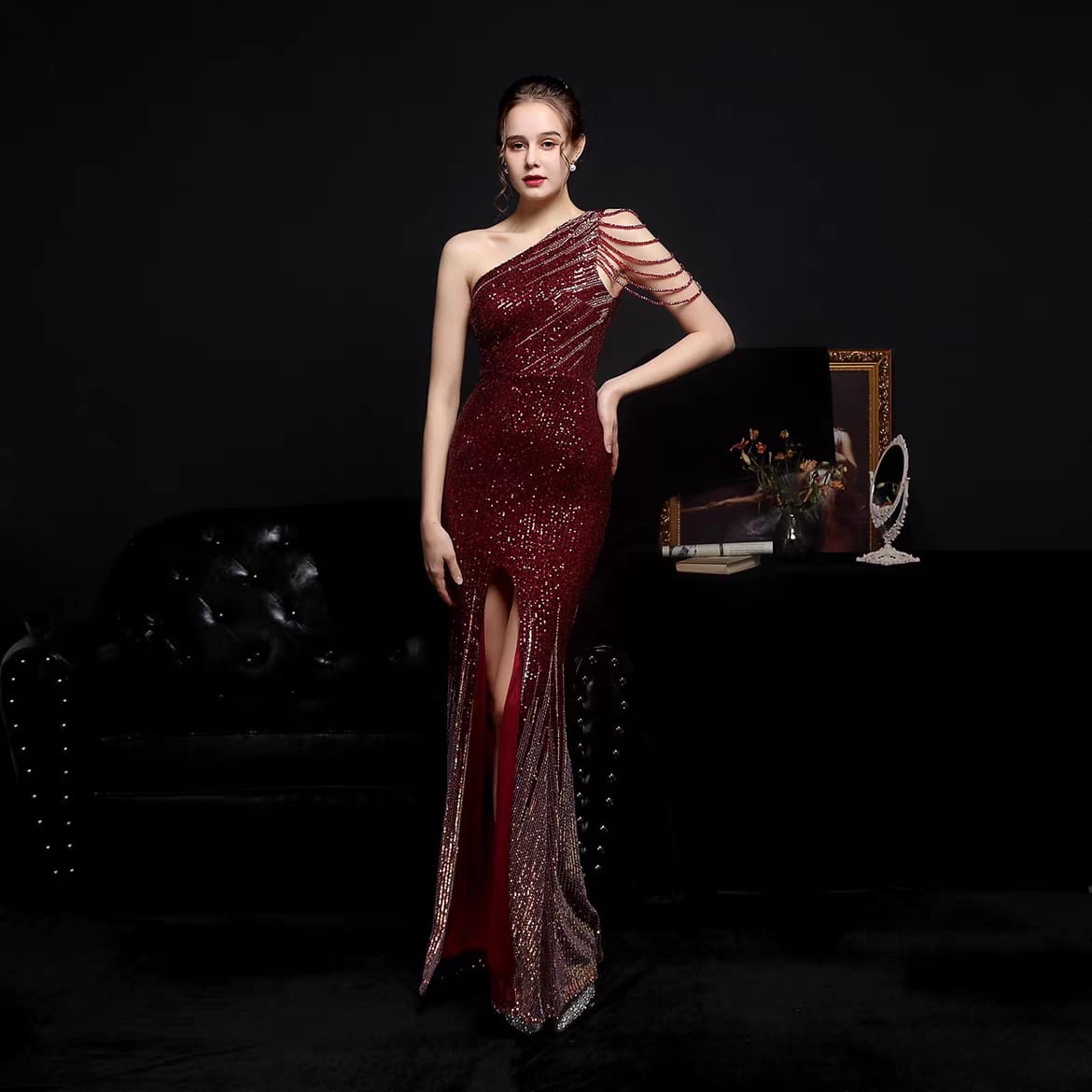 Woman's slanted off shoulder sequenced evening dress