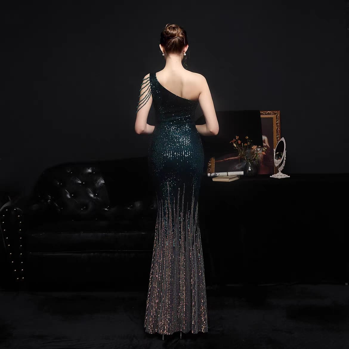 Woman's slanted off shoulder sequenced evening dress