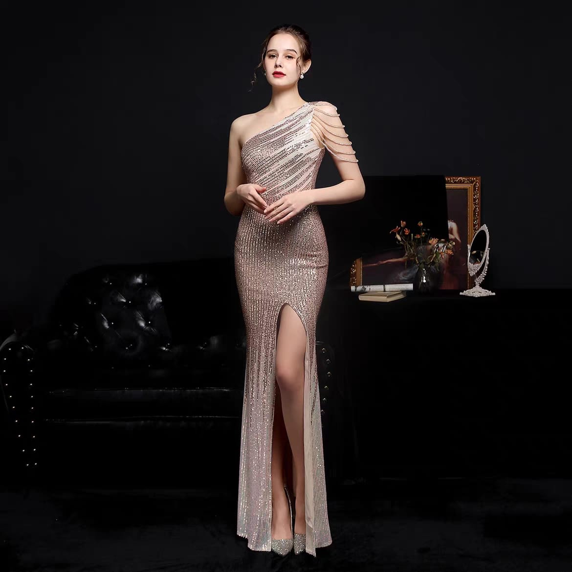 Woman's slanted off shoulder sequenced evening dress