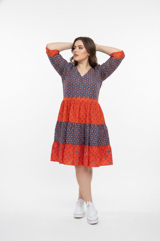 orange spotted circular design midi dress