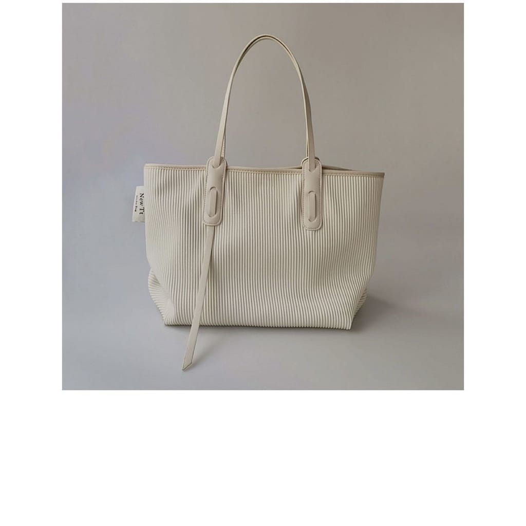 Beige hand bag.