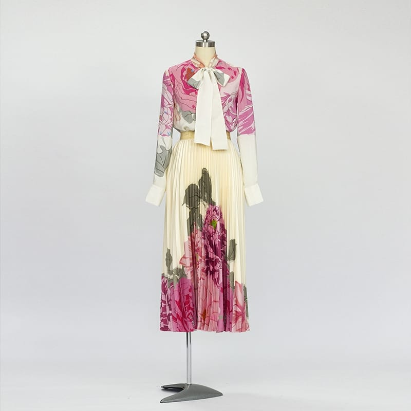 Pleated skirt and button down blouse two piece set.
