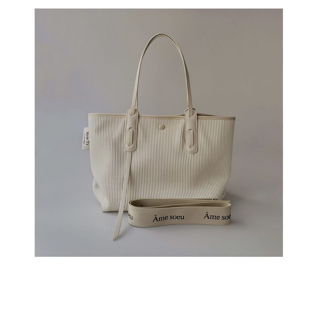 Beige hand bag.